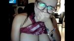 Nerd girlfriend showing big tits behind her boyfriend